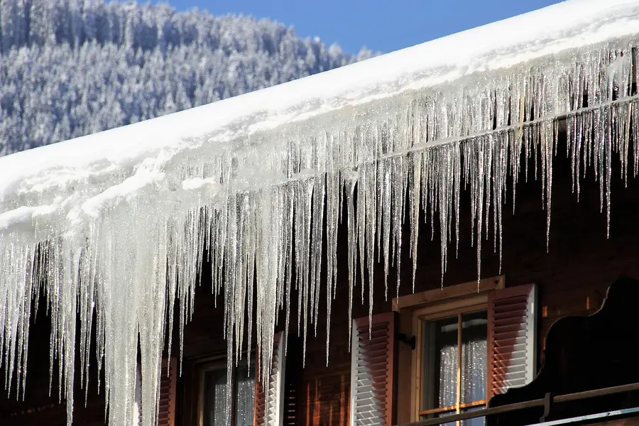 Icicles hanging from a gutter in winter